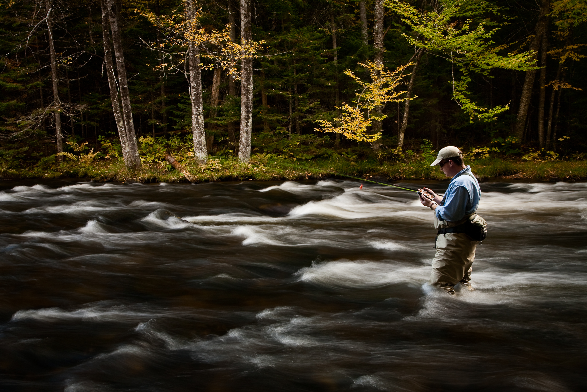 Image of a fly fisherman on the upper Connecticut River, NH